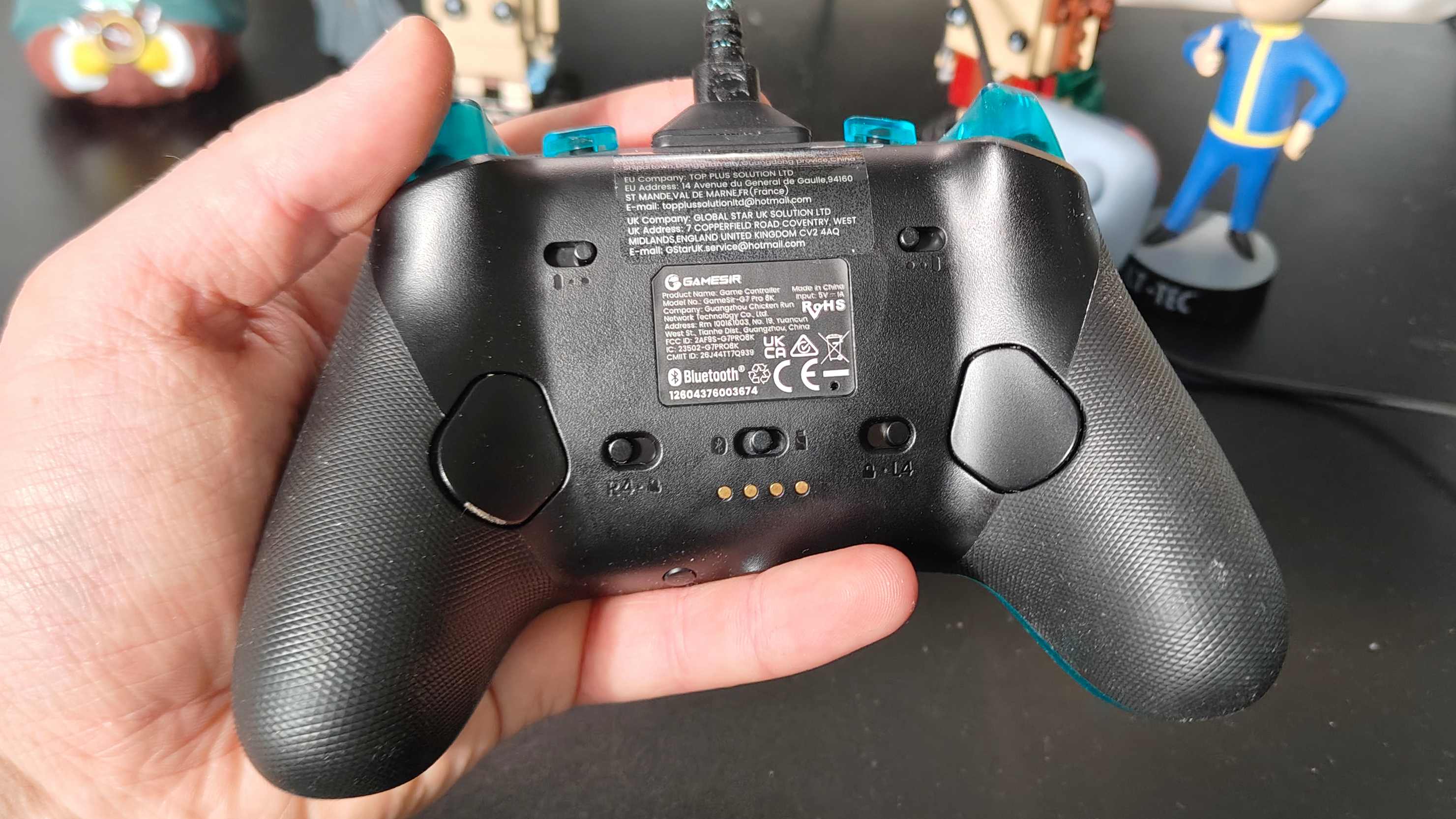 The GameSir G7 Pro 8k in a man's hand.
