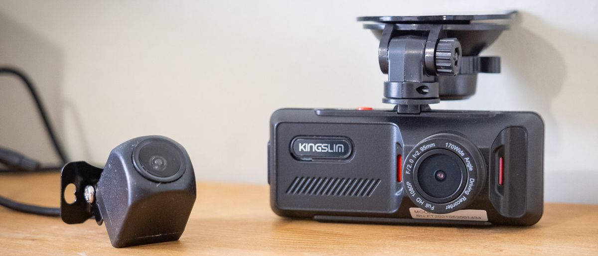 Kingslim D1 dash cam components sitting on a desk