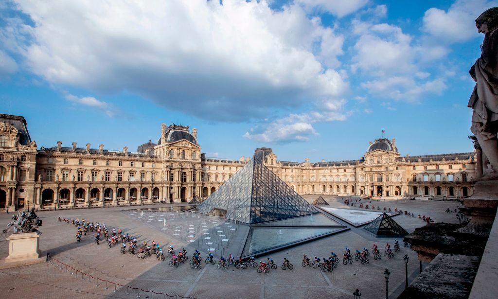 The pack rides in front of the Louvre pyramid and museum during the 21st and last stage of the 107th edition of the Tour de France cycling race 122 km between ManteslaJolie and Champs Elysees Paris on September 20 2020 Photo by YOAN VALAT POOL AFP RESTRICTED TO EDITORIAL USE MANDATORY MENTION OF THE ARTIST UPON PUBLICATION TO ILLUSTRATE THE EVENT AS SPECIFIED IN THE CAPTION Photo by YOAN VALATPOOLAFP via Getty Images