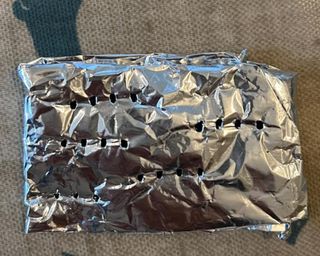 A tinfoil parcel with holes poked in it