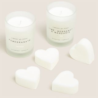 Two white M&S candles