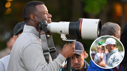 Ken Griffey Jr holds a camera