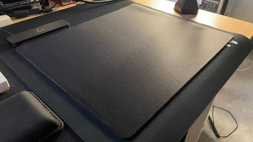 Logitech G Pro PowerPlay 2 mousepad on top of another mousepad on top of a third mousepad on top of a desk