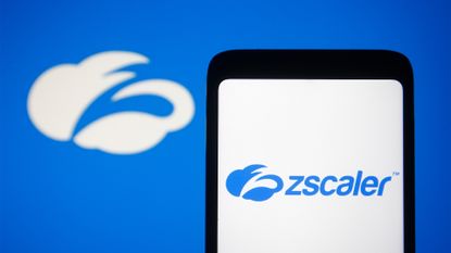 Zscaler logo displayed on a smartphone screen with branding in background.