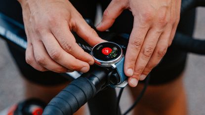 best triathlon watch: Polar's Vantage V3 multisport watch mounted on a bike