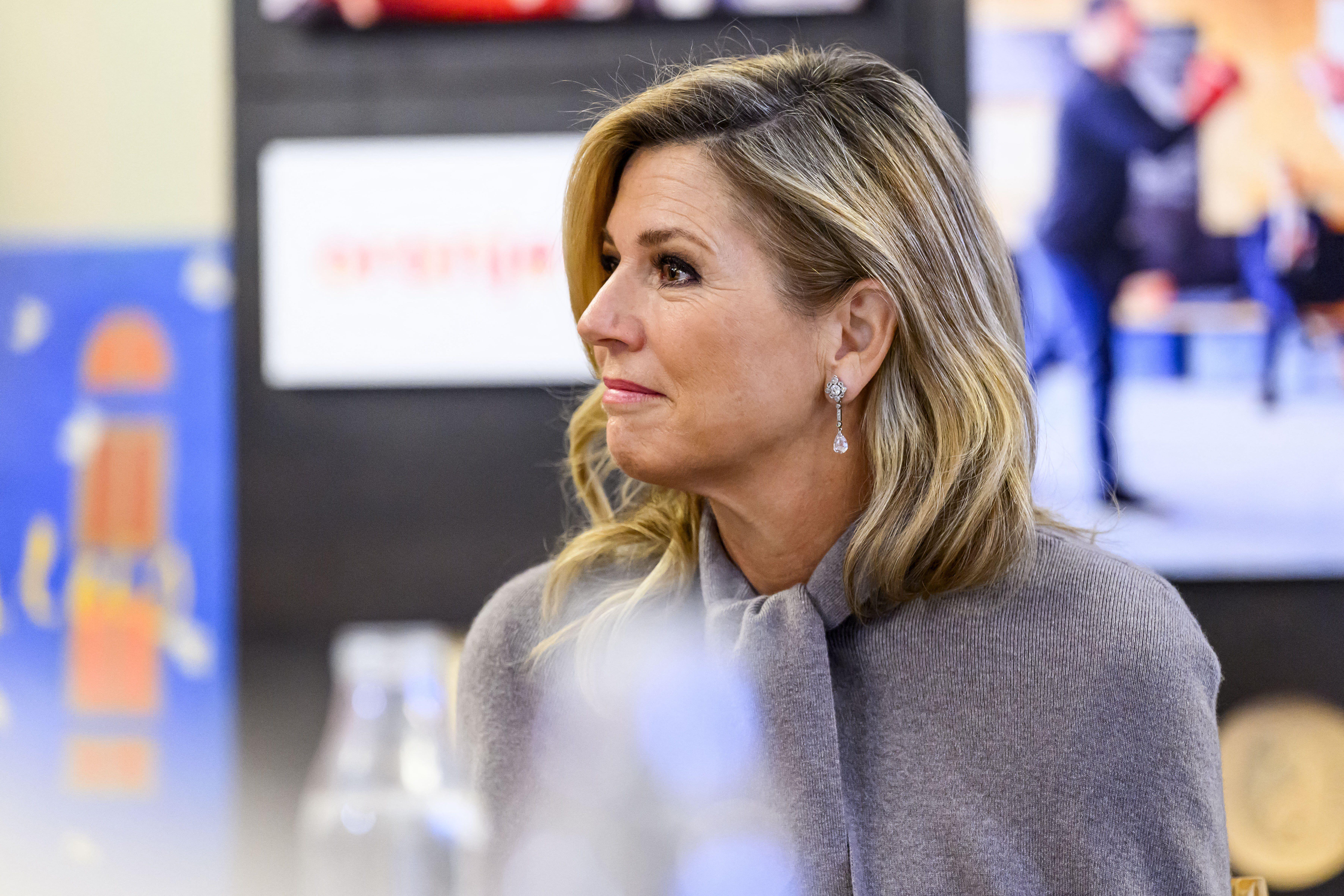 Queen Maxima wearing a gray cape