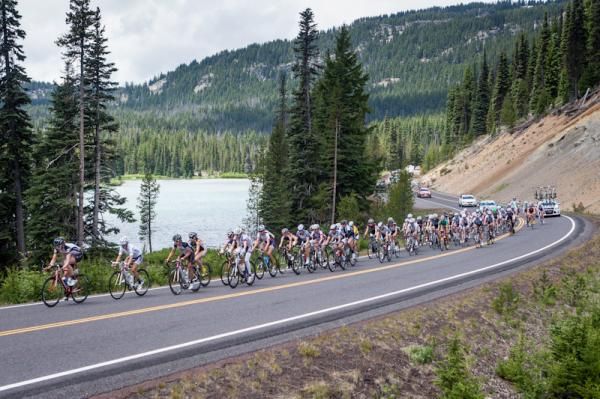 The women's peloton passes one of the glacial lakes heading to Mt. Bachelor