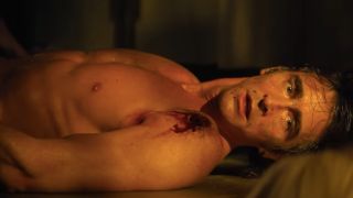 A shocked Lee Pace lies naked and wounded on the floor in Foundation.