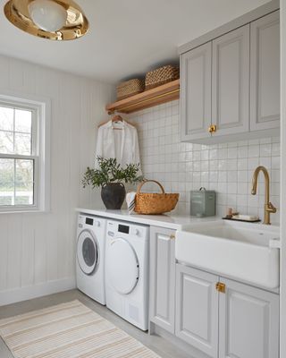 laundry room storage ideas open shelving and hanging rail by Tiffany Leigh Design