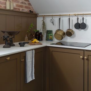 brown Shaker kitchen with white worktops