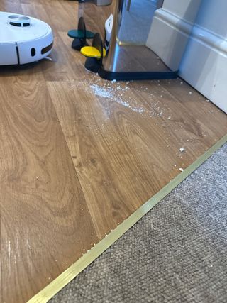 a picture of the author's kitchen floor showing the EZVIZ RS20 Pro leaking debris