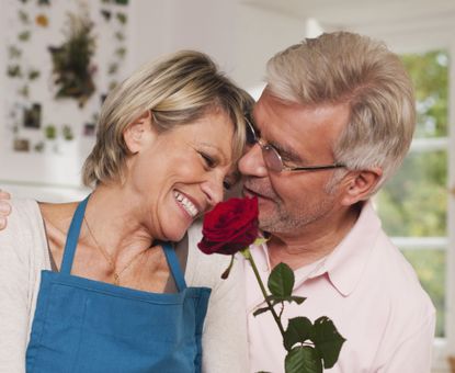 Couple holding a rose