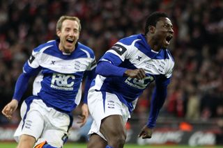 Obafemi Martins celebrates after scoring a late winner for Birmingham City against Arsenal in the 2011 League Cup final.