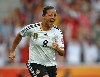 Inka Grings of Germany celebrates scoring the scecond goal during the FIFA Women's World Cup 2011 Group A match between France and Germany at Borussia Park on July 5, 2011 in Moenchengladbach, Germany. (Photo by Laurence Griffiths - FIFA/FIFA via Getty Images)