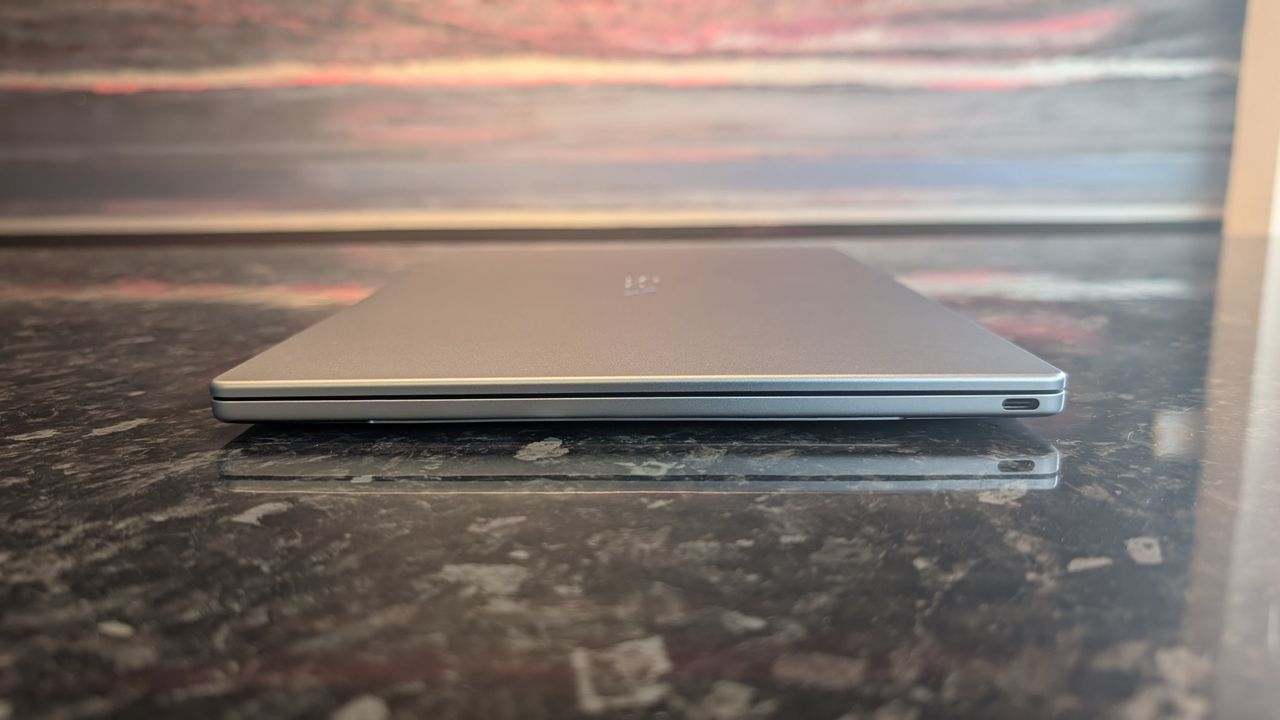 The Dell XPS 13 (2026) laptop pictured on a black marble worktop.