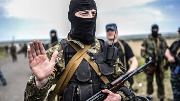 A pro-Russian separatist at the MH17 crash-site in Ukraine