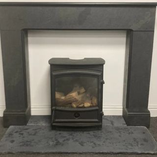 black log burner on dark grey slate hearth