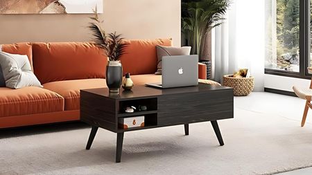 Living room with orange sofa and brown wooden coffee table