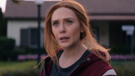 Elizabeth Olsen looking forward and up in WandaVision. 