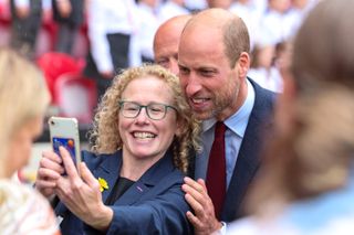 Prince William poses with a fan at Parc y Scarlets in Llanelli, Wales on September 10, 2024.