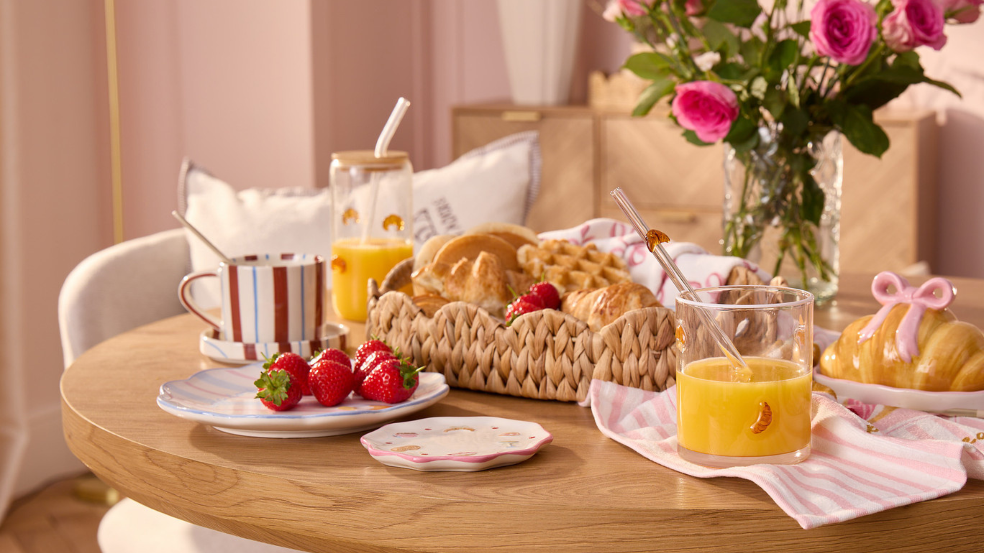 B&amp;M Brunch Club tableware and pink roses on a table.