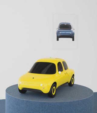 Model of yellow car on exhibition plinth