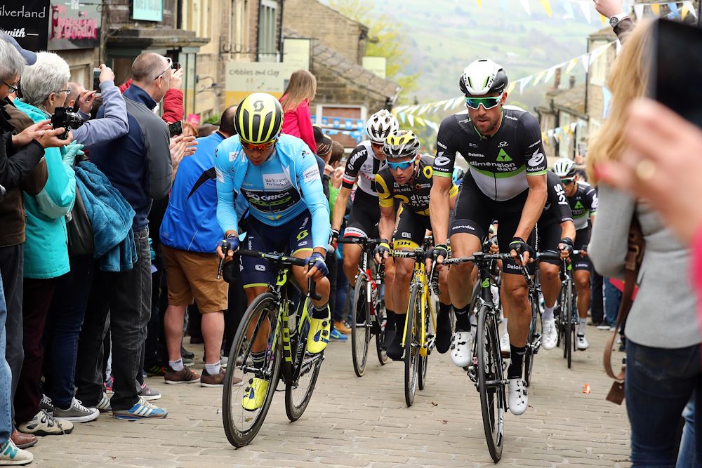 Race leader Caleb Ewan (l) of Australia and Orica-Scott rides through Howarth during stage 3 of the 2017 Tour de Yorkshire