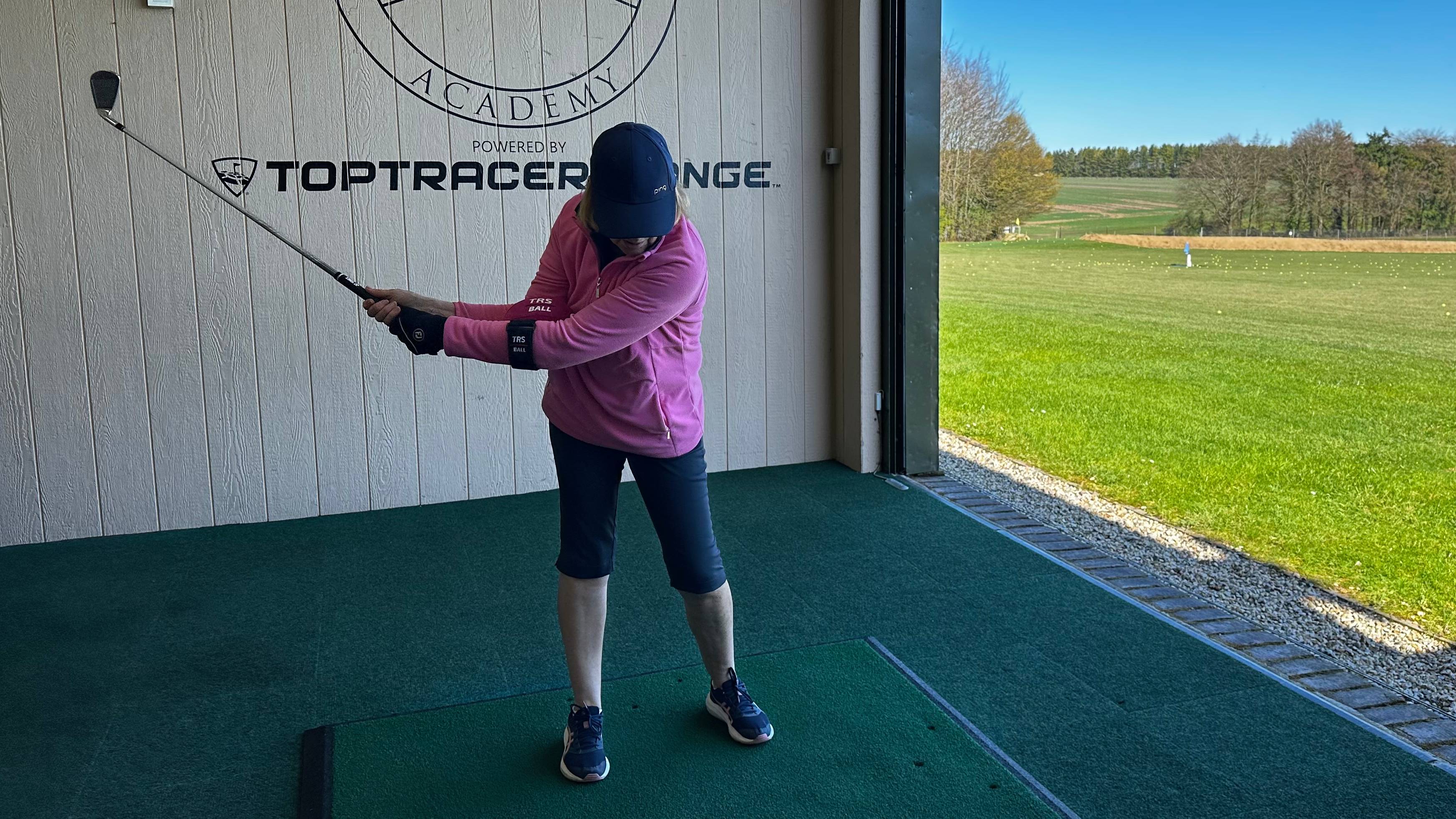 Female golfer using TRS Ball training aid