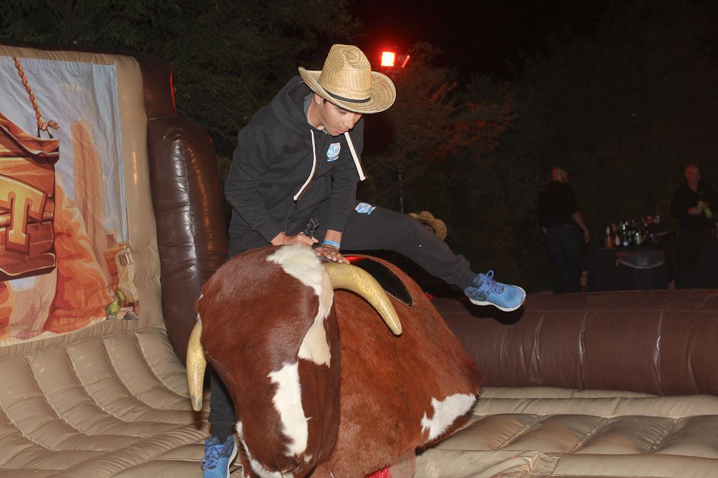 A Polartec-Kometa rider hops on the mechanical bull