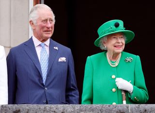 Prince Charles, Prince of Wales and Queen Elizabeth II stand on the balcony of Buckingham Palace following the Platinum Pageant on June 5, 2022 in London, England. The Platinum Jubilee of Elizabeth II is being celebrated from June 2 to June 5, 2022, in the UK and Commonwealth to mark the 70th anniversary of the accession of Queen Elizabeth II on 6 February 1952.