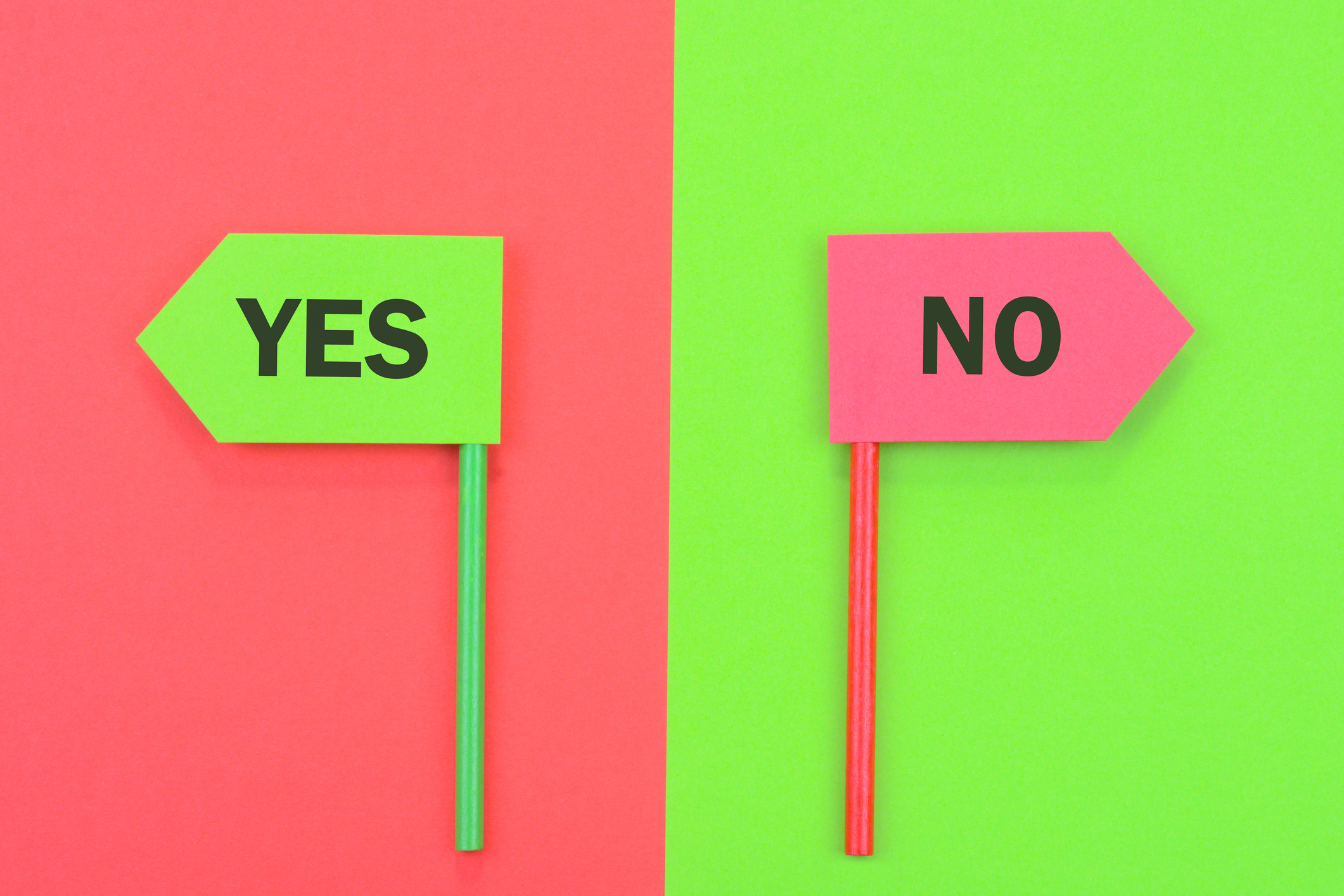 Concept of decision making. Yes and No signs pointing in opposite direction.