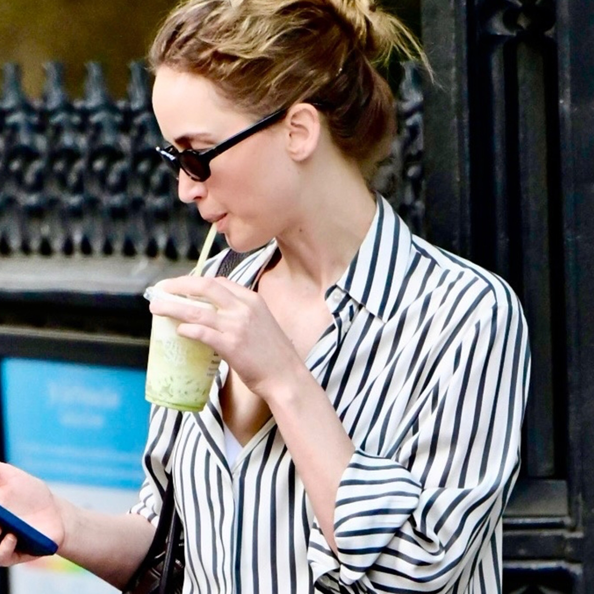 Jennifer Lawrence was spotted showcasing a stylish street style look while out and about in New York City. The actress paired a pair of wide leg pants in a bright coral with a black and white stripe shirt and loafers from the Row in buttery yellow.
