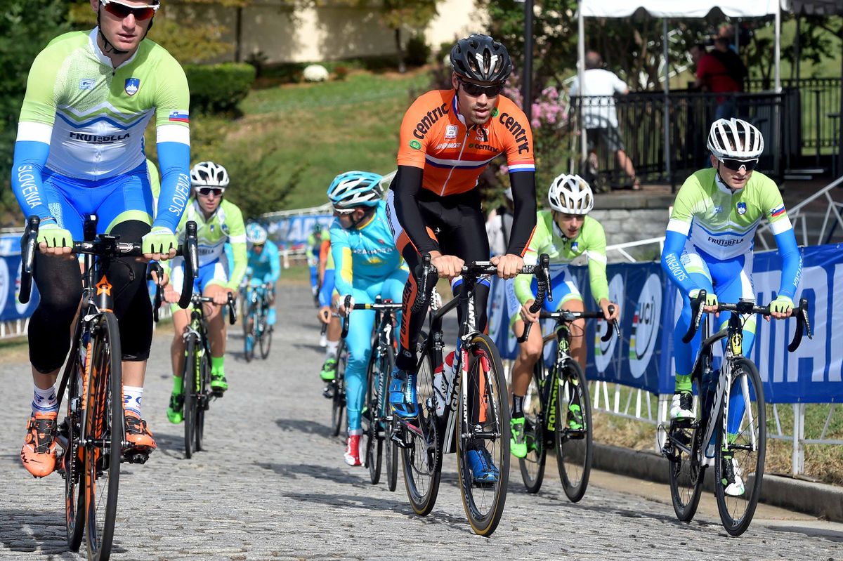 Tom Dumoulin (Netherlands) surrounded by blue and green