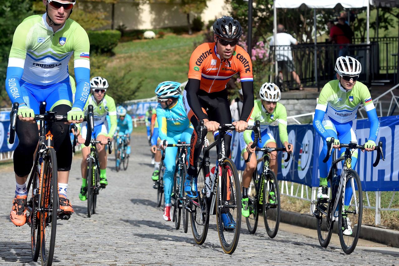Tom Dumoulin (Netherlands) surrounded by blue and green