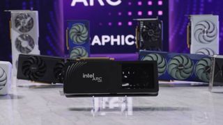 Intel Arc B580 limited edition graphics card on table with custom options in backdrop