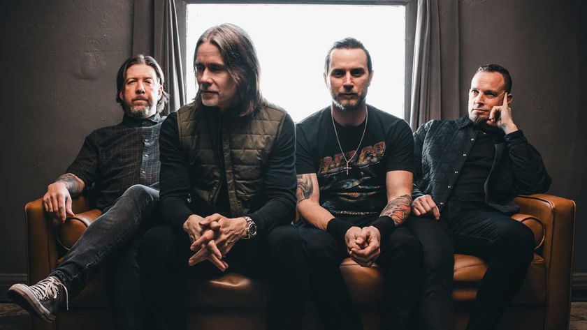 Alter Bridge sitting in front of a window