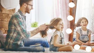 Cotanic Vanity LED light bulb 5000k dad fixing daughter's hair in front of a lit mirror