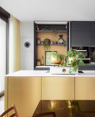 gold kitchen island in a modern kitchen