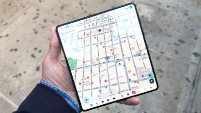 The Motorola Razr Fold being held in the hand