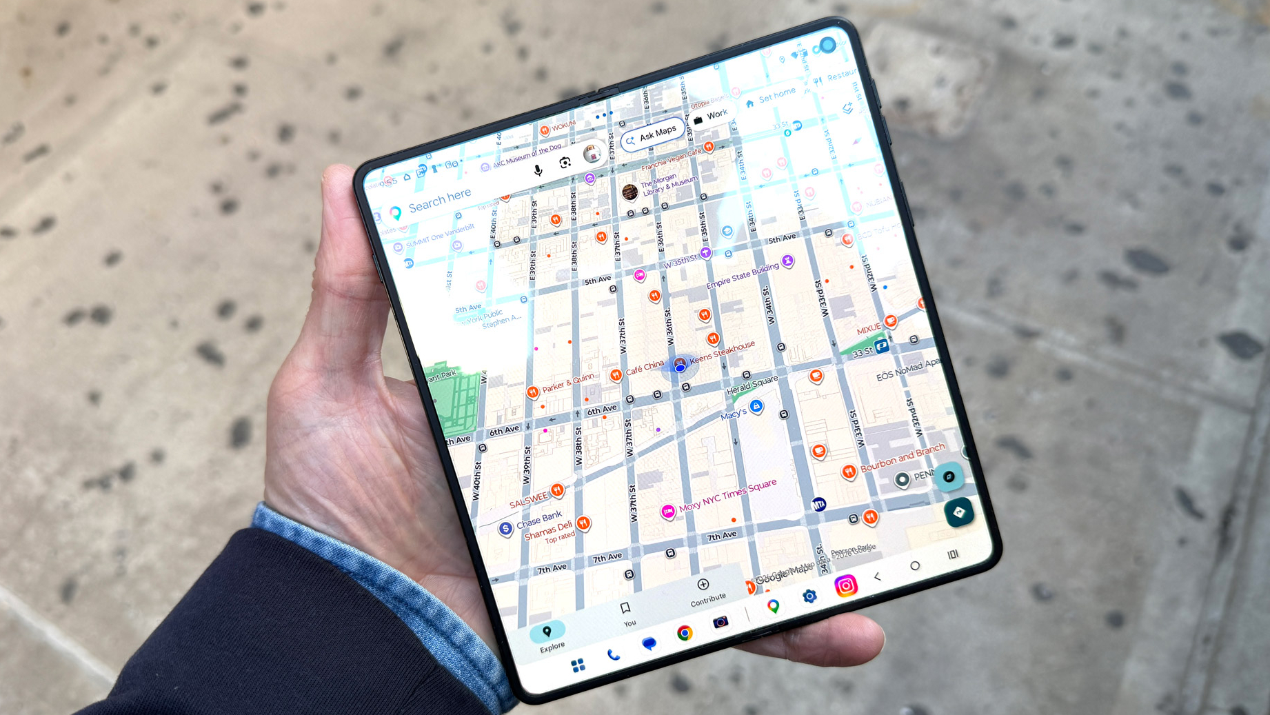 The Motorola Razr Fold being held in the hand