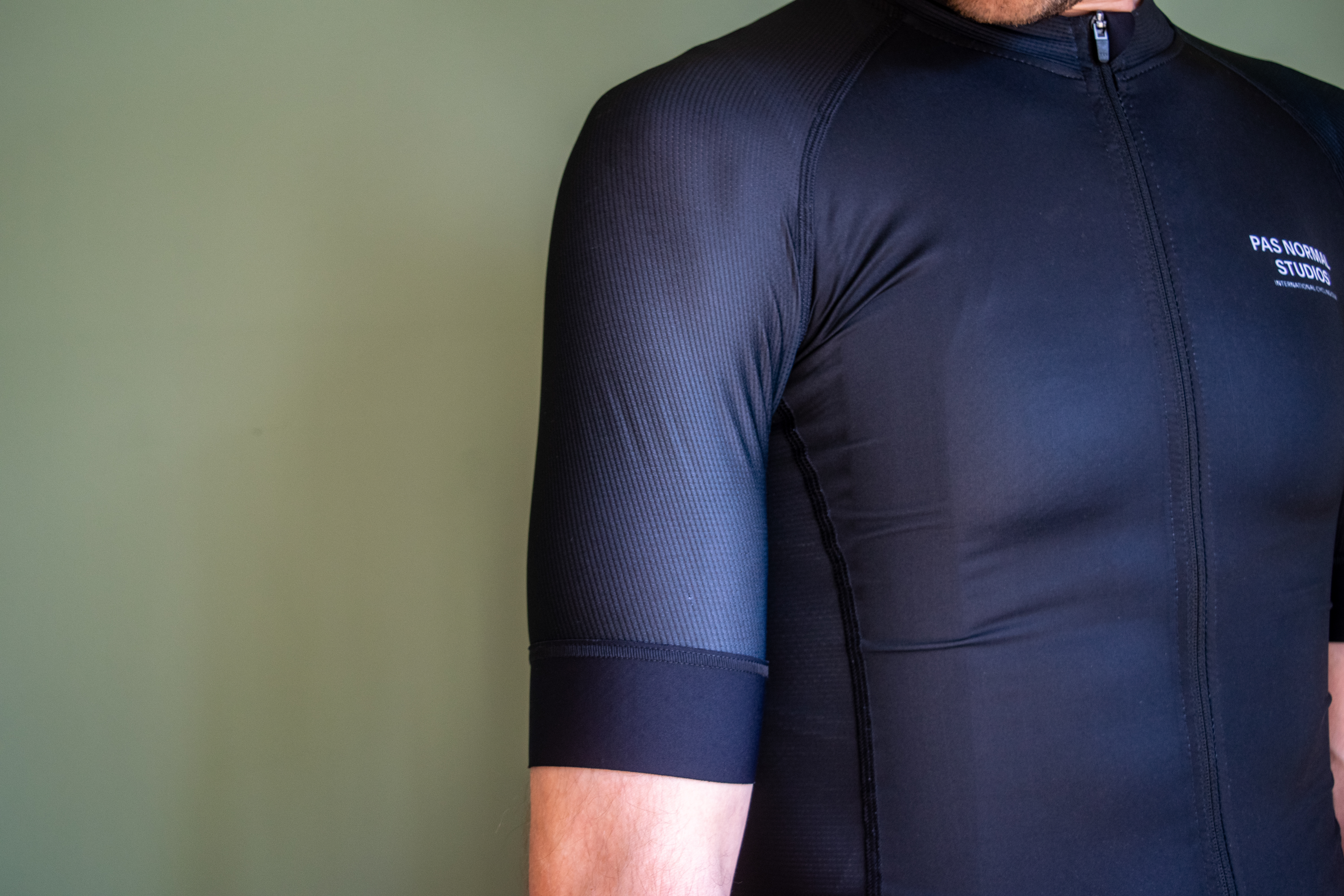 A man wearing a black PNS Mechanism jersey