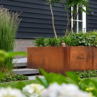 Corten steel planter with foliage plants