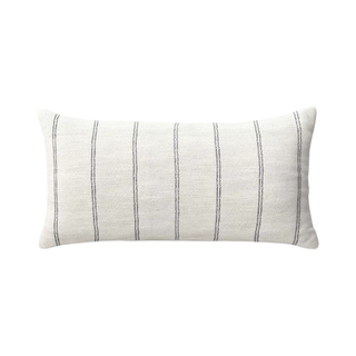 A white striped lumbar pillow