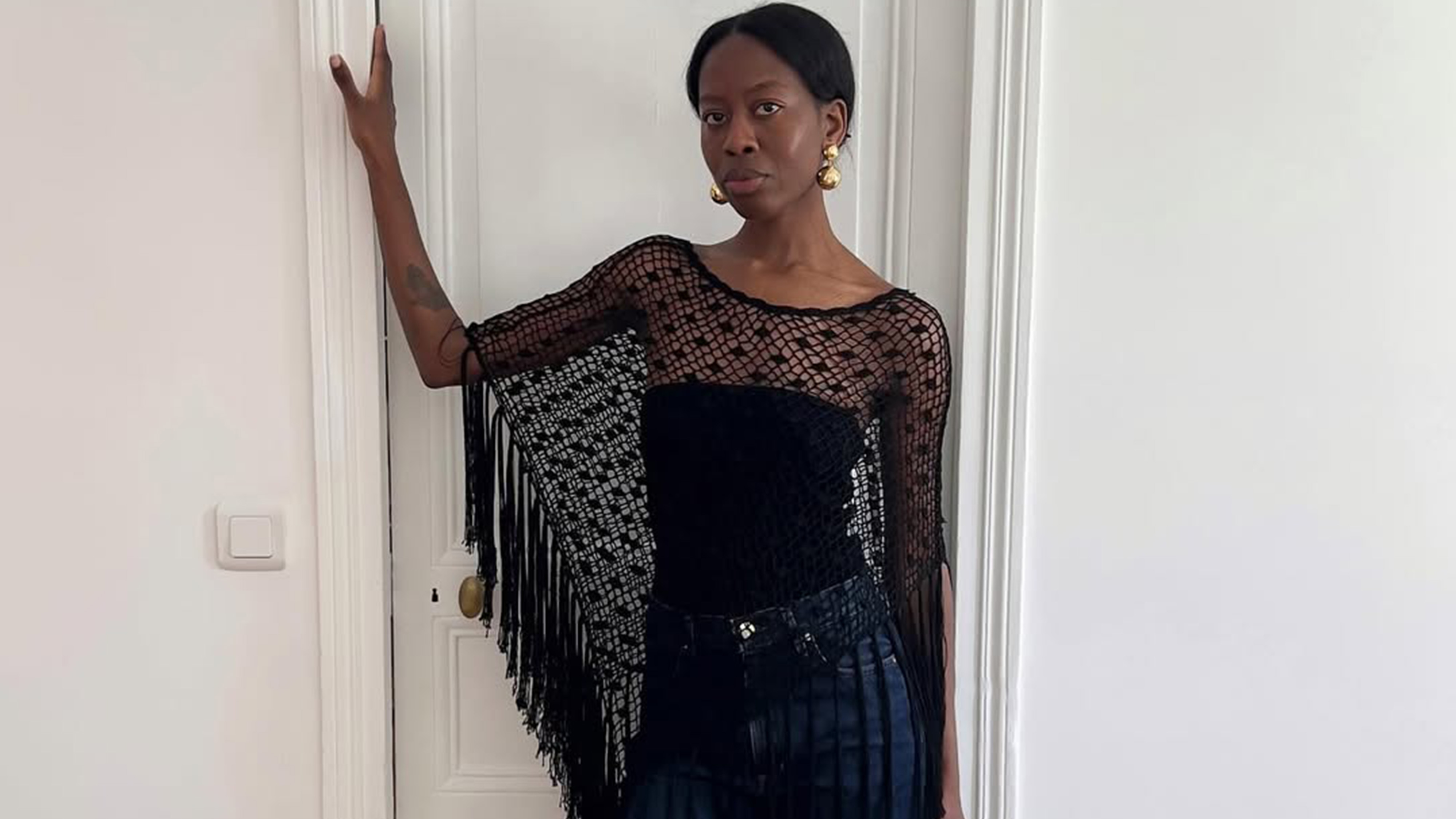 Sylvie Mus wearing a poncho.