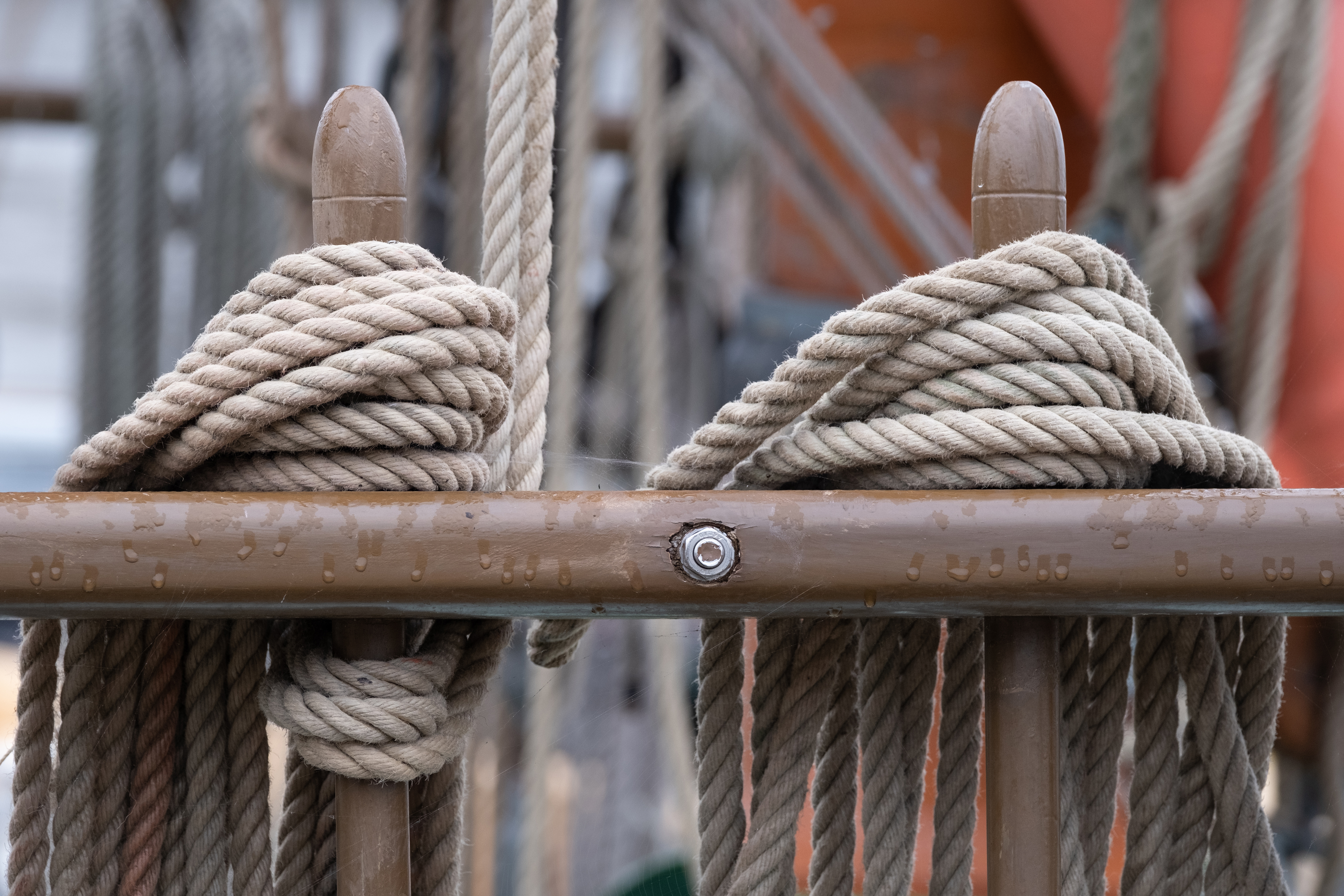 Some gathered ropes on the side of a boat