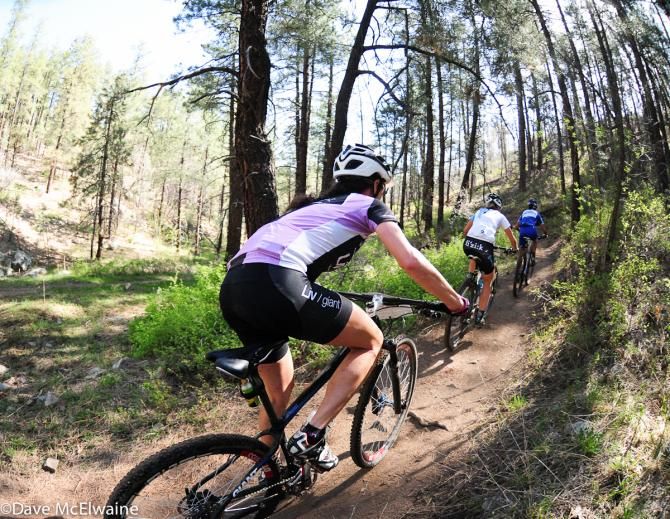 Kelli Emmett (Team Giant) following Chloe Woodruff and Katerina Nash on a singletrack climb