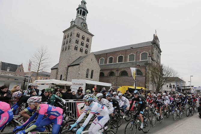 Racers pass a church