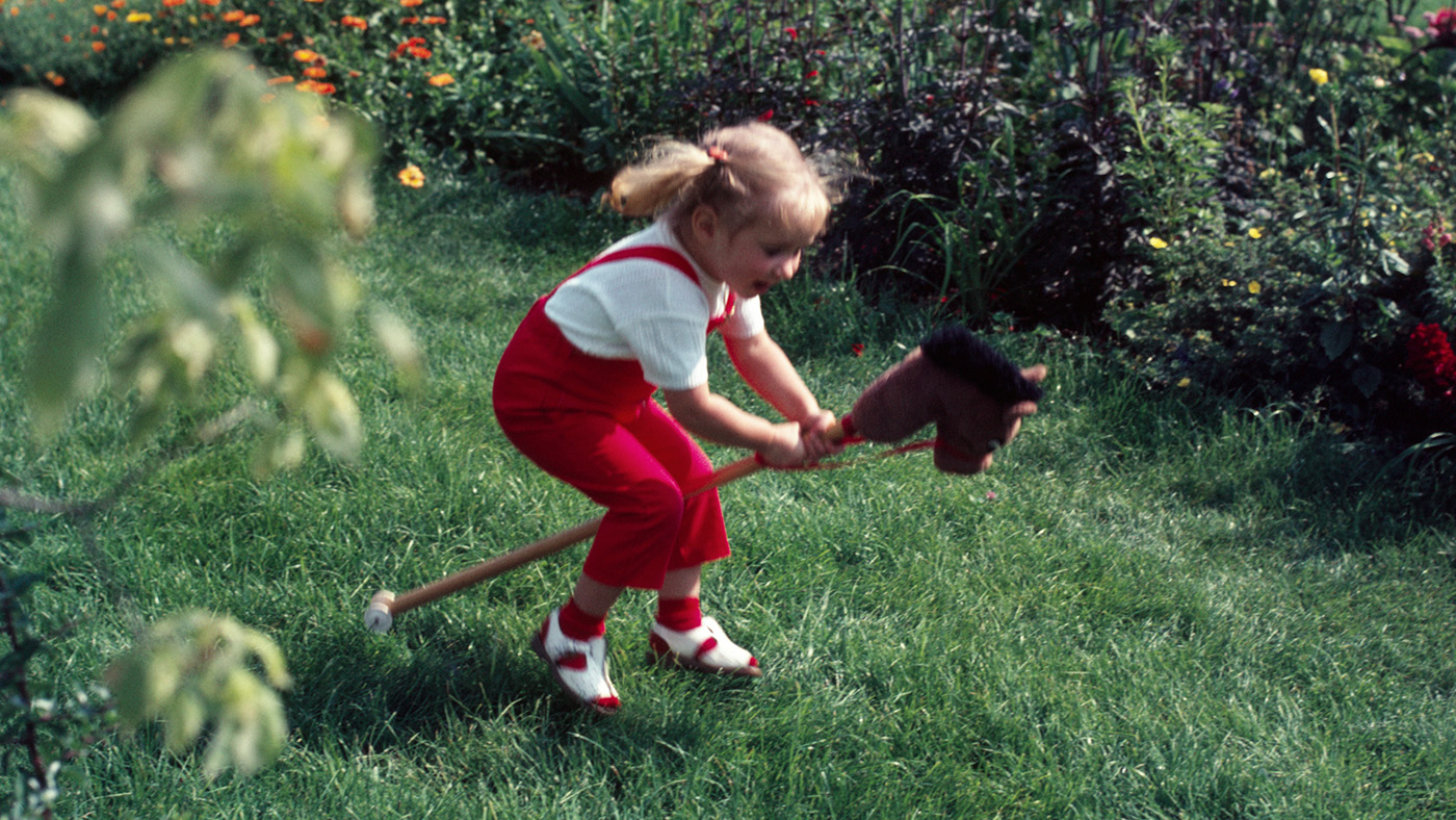 A child plays on a hobbyhorse