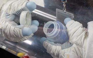 The EVA glove simulator challenged users to put the top on the bottle and screw it down into place in a container whose air had been drawn out.