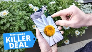 Samsung Galaxy S25 Ultra held in hand with a killer deal tag